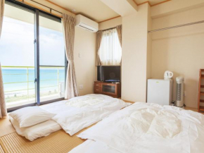 Отель Kariyushi Condominium Ocean Hills Chouraku Stay  Кин